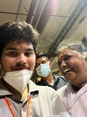 A university student taking a selfie with Amma